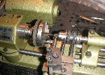 Press-fitting the reset pin.